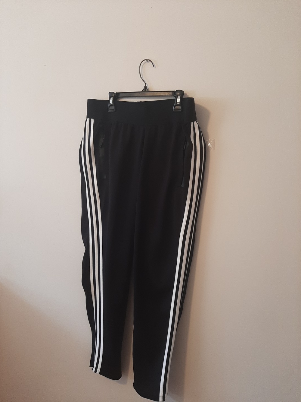 Adidas Track pants. Zippered leg.  Black. Medium. Elastic stretch waist.…